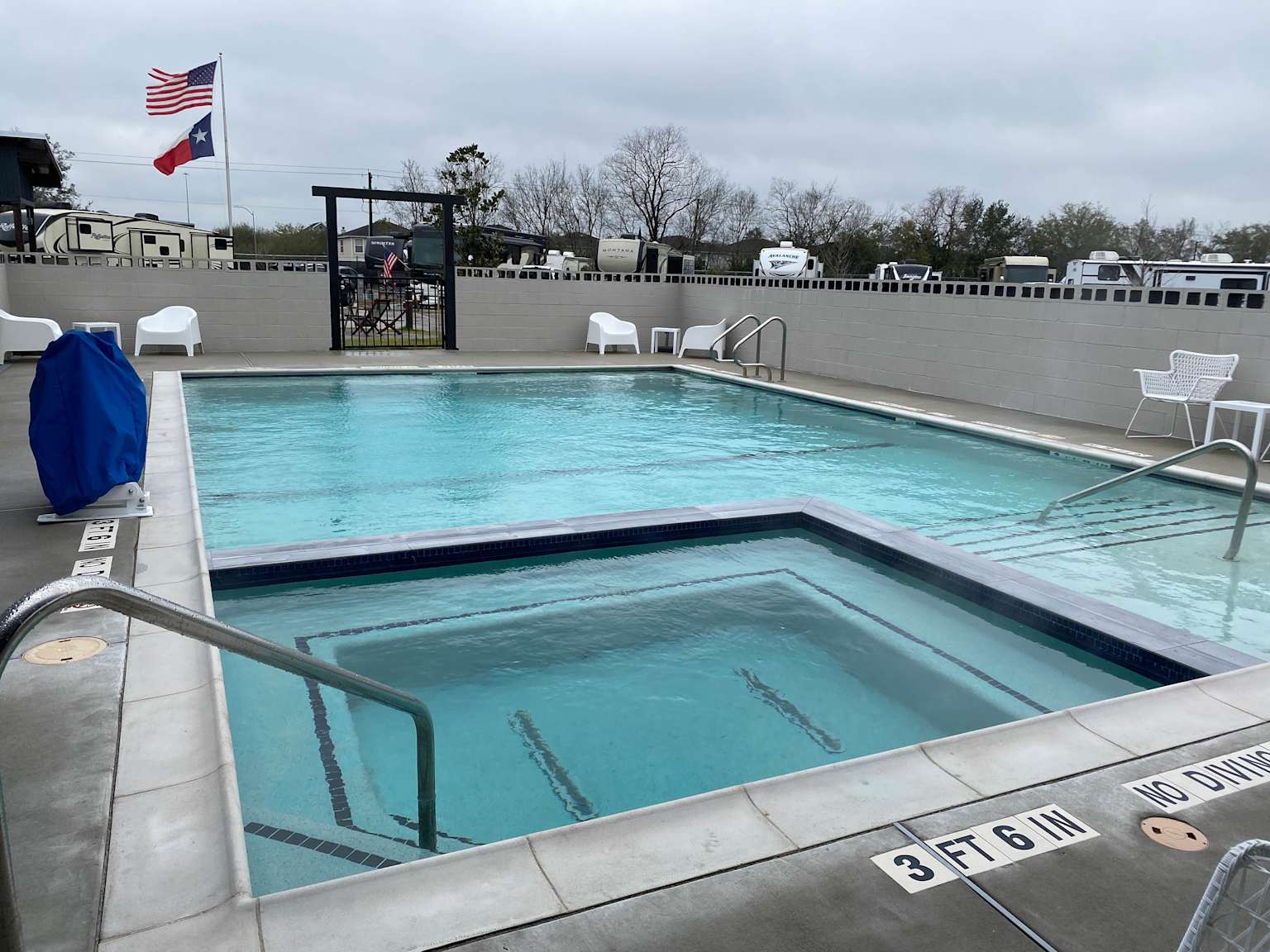 Outdoor swimming pool and hot tub area at Eric & Jay